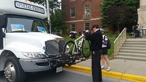 Picture of bicycle being loaded onto a shuttle.