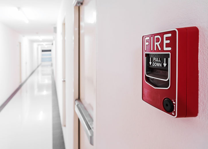 Fire alarm pull station on a wall